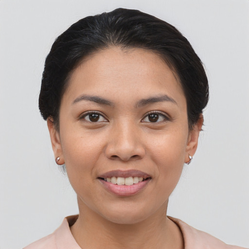Joyful white young-adult female with short  black hair and brown eyes