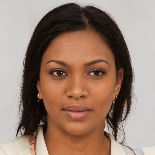 Neutral black young-adult female with medium  brown hair and brown eyes