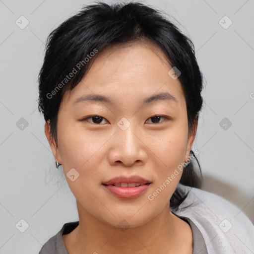 Joyful asian young-adult female with medium  black hair and brown eyes