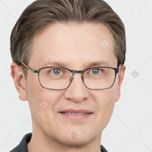 Joyful white adult male with short  brown hair and grey eyes