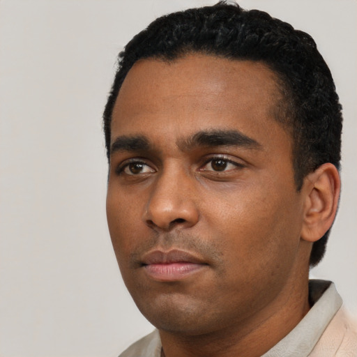 Neutral black young-adult male with short  black hair and brown eyes