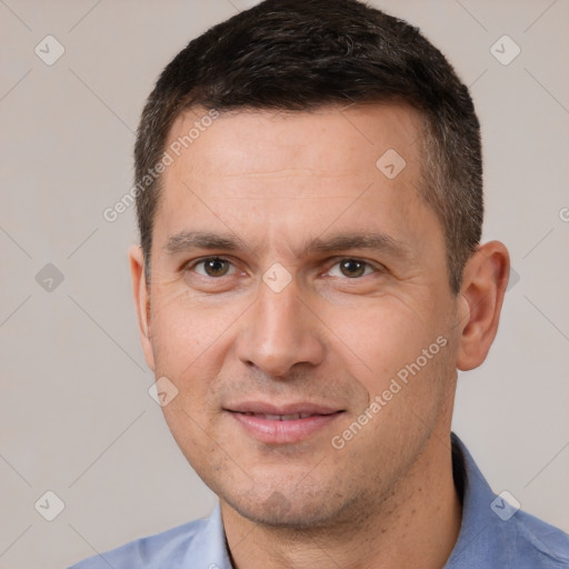 Joyful white adult male with short  brown hair and brown eyes