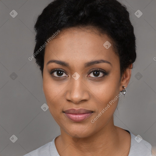 Joyful black young-adult female with short  black hair and brown eyes