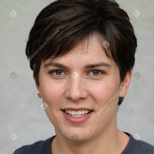 Joyful white young-adult female with short  brown hair and grey eyes