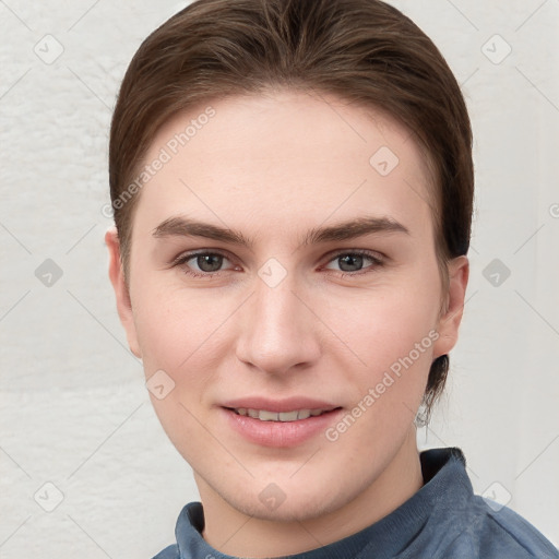 Joyful white young-adult female with short  brown hair and grey eyes