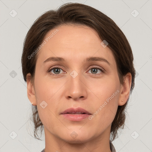 Joyful white adult female with medium  brown hair and grey eyes