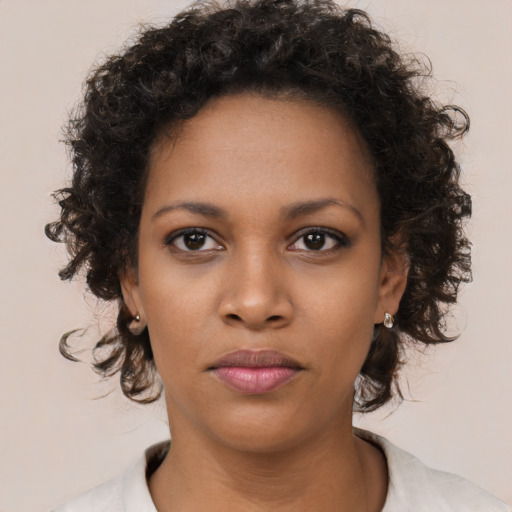 Neutral black young-adult female with short  brown hair and brown eyes