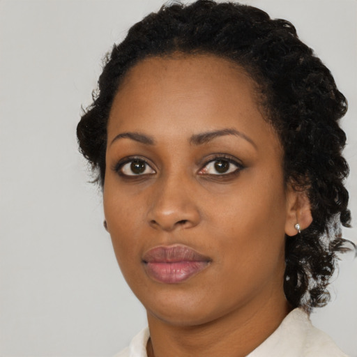 Neutral black young-adult female with medium  black hair and brown eyes