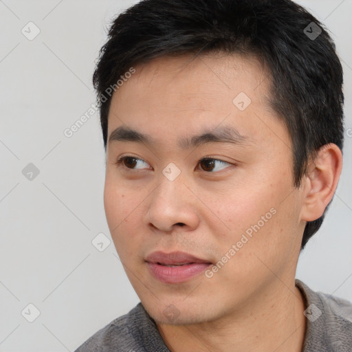 Neutral asian young-adult male with short  black hair and brown eyes