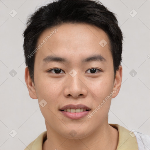 Joyful asian young-adult male with short  black hair and brown eyes