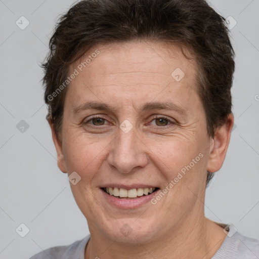 Joyful white adult female with short  brown hair and brown eyes