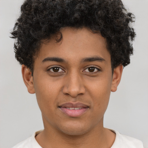 Joyful latino young-adult male with short  brown hair and brown eyes