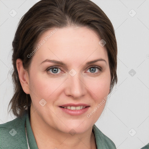 Joyful white young-adult female with medium  brown hair and blue eyes