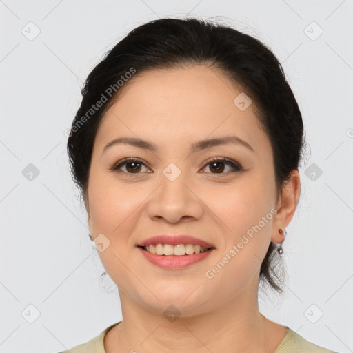 Joyful asian young-adult female with medium  brown hair and brown eyes