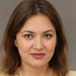 Joyful white young-adult female with medium  brown hair and brown eyes