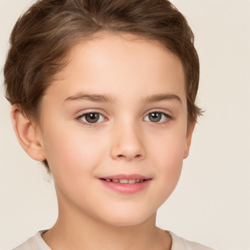 Joyful white child female with short  brown hair and brown eyes