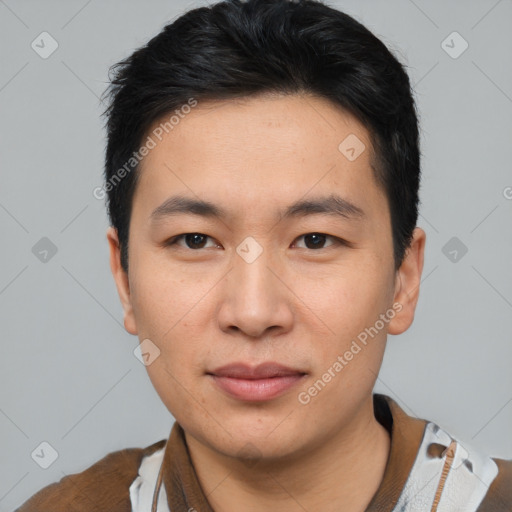 Joyful asian young-adult male with short  black hair and brown eyes