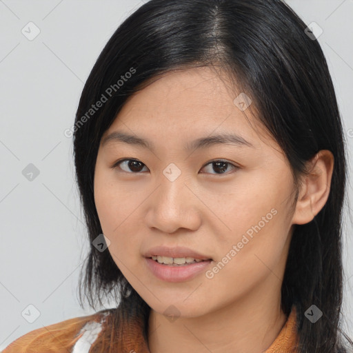 Joyful asian young-adult female with long  brown hair and brown eyes