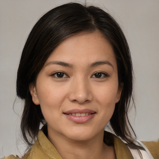Joyful white young-adult female with medium  brown hair and brown eyes