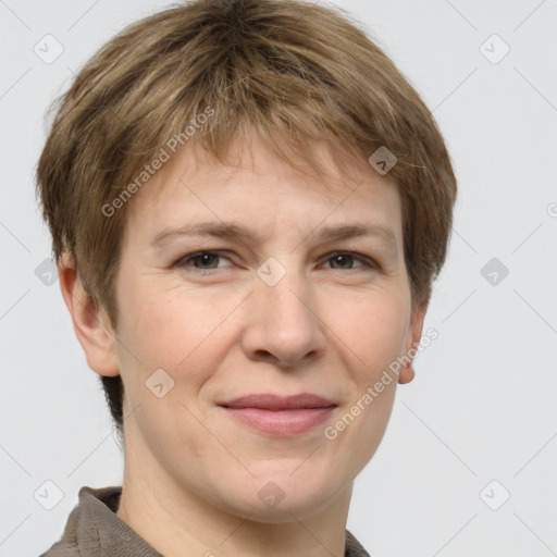 Joyful white adult female with short  brown hair and grey eyes