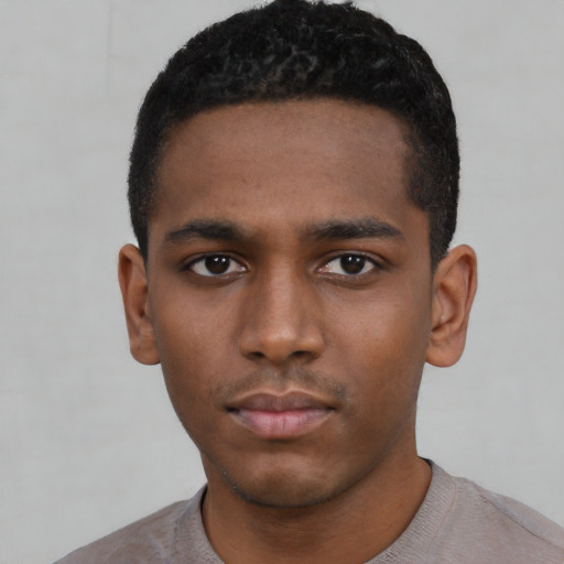 Neutral black young-adult male with short  black hair and brown eyes