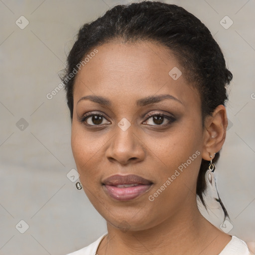 Joyful black young-adult female with medium  brown hair and brown eyes