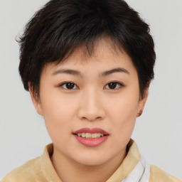 Joyful asian young-adult female with short  brown hair and brown eyes