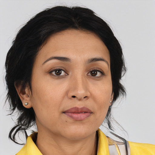 Joyful asian adult female with medium  brown hair and brown eyes