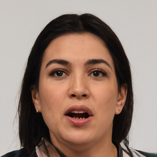 Joyful asian young-adult female with medium  black hair and brown eyes