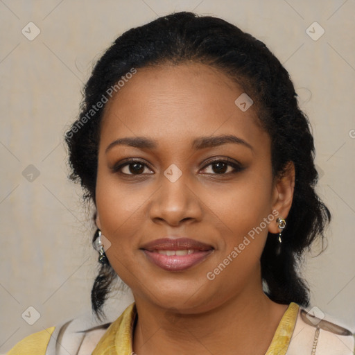 Joyful black young-adult female with long  black hair and brown eyes