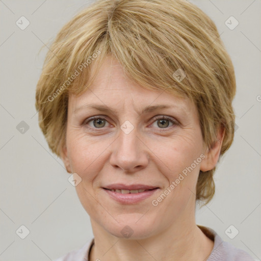 Joyful white adult female with medium  brown hair and grey eyes