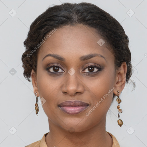 Joyful black young-adult female with long  brown hair and brown eyes