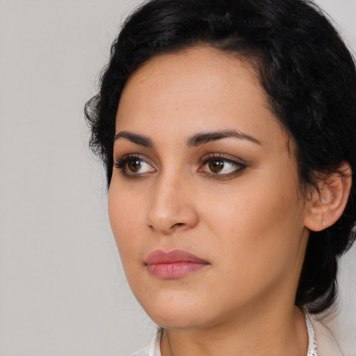 Neutral latino young-adult female with long  black hair and brown eyes