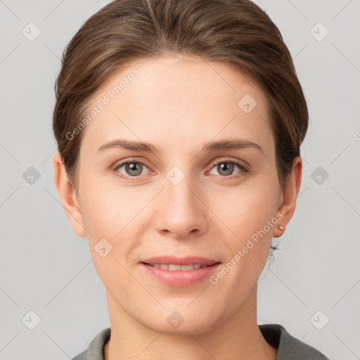 Joyful white young-adult female with short  brown hair and grey eyes