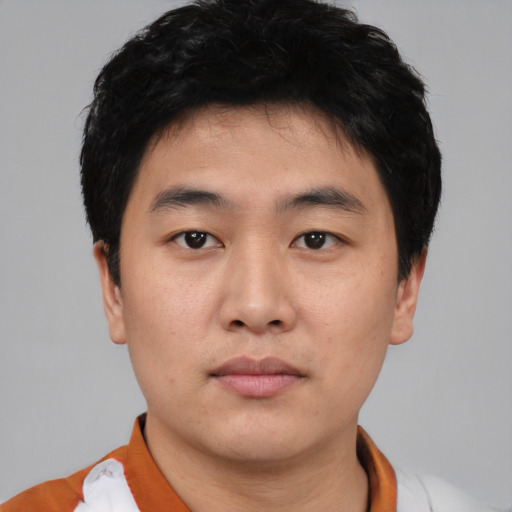 Neutral asian young-adult male with short  black hair and brown eyes