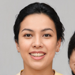 Joyful asian young-adult female with medium  brown hair and brown eyes