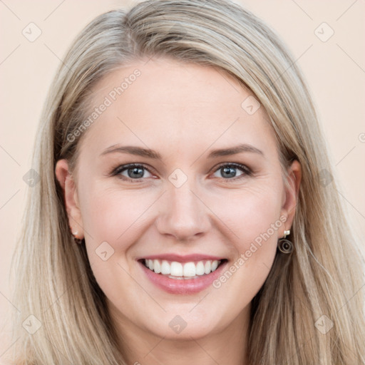 Joyful white young-adult female with long  brown hair and blue eyes