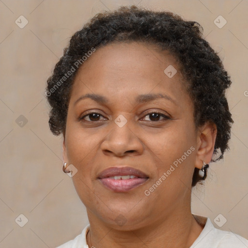 Joyful black adult female with short  brown hair and brown eyes