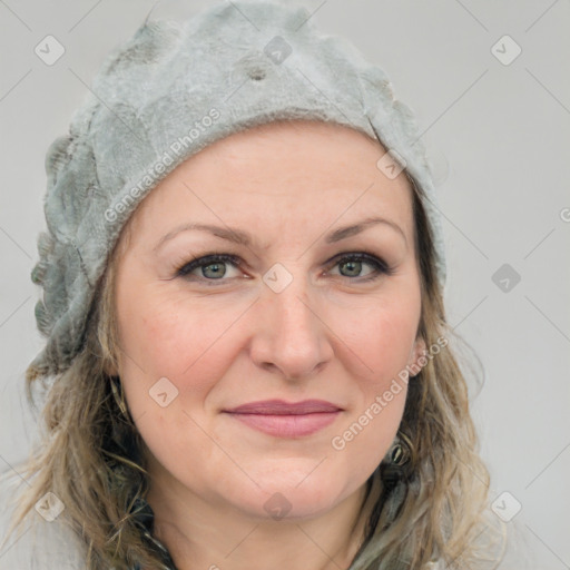 Joyful white adult female with medium  brown hair and blue eyes