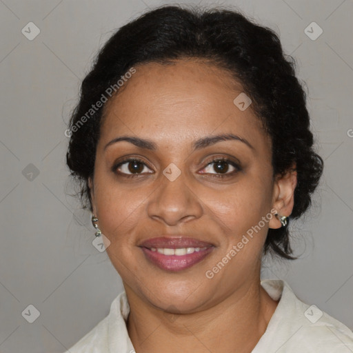 Joyful black adult female with medium  brown hair and brown eyes