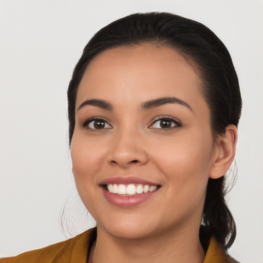 Joyful white young-adult female with long  black hair and brown eyes