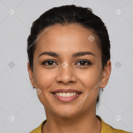 Joyful latino young-adult female with short  brown hair and brown eyes