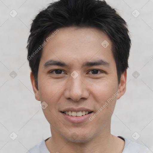 Joyful white young-adult male with short  black hair and brown eyes