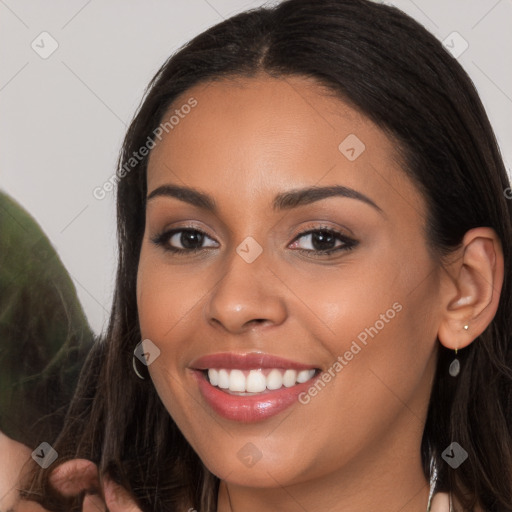 Joyful white young-adult female with long  brown hair and brown eyes