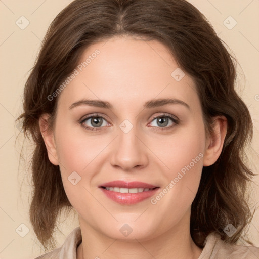 Joyful white young-adult female with medium  brown hair and green eyes