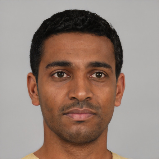 Neutral black young-adult male with short  black hair and brown eyes