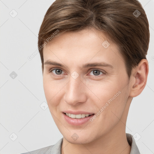 Joyful white young-adult female with short  brown hair and grey eyes