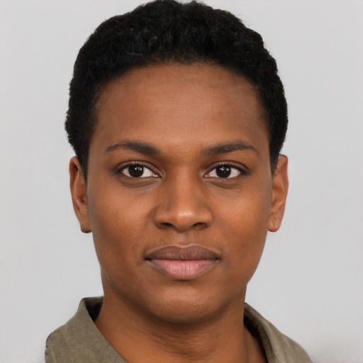 Joyful black young-adult female with short  black hair and brown eyes