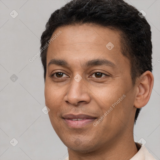 Joyful latino young-adult male with short  brown hair and brown eyes