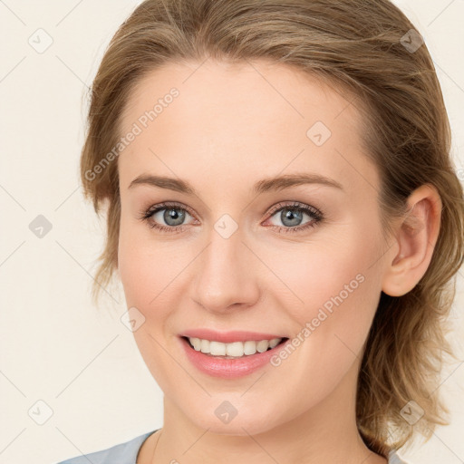 Joyful white young-adult female with medium  brown hair and blue eyes